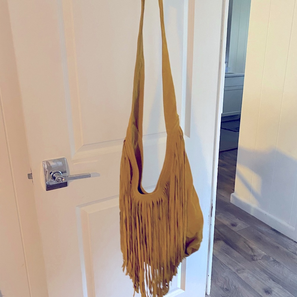Suede crossbody hobo bag with tassels